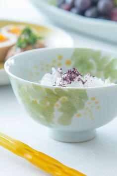 a bowl filled with food sitting on top of a table