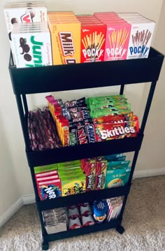 a shelf filled with snacks on top of carpeted floor