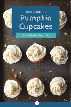 pumpkin cupcakes with white frosting and walnuts on a baking sheet, top view