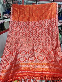 Experience the luxurious elegance of Assam silk with our handcrafted mekhela chadors. Each piece is carefully crafted using only the finest silk from the Assam region in India, known for its softness and durability. The intricate designs and traditional motifs make these mekhela chadors perfect for any special occasion, or simply as a statement piece in your wardrobe. Perfect for a modern women who want to keep her traditional roots alive. Each chador is unique and made with love, so you can be Orange Tussar Silk Traditional Wear For Wedding, Semi-stitched Traditional Wear For Eid Rituals, Orange Tussar Silk Traditional Wear For Festive Season, Unstitched Blouse Piece With Traditional Drape For Rituals, Unstitched Blouse Piece With Pallu For Rituals, Semi-stitched Pallu Saree For Rituals, Orange Tussar Silk Traditional Wear For Diwali, Unstitched Orange Traditional Wear For Eid, Zari Weaving Lehenga For Rituals And Festivals