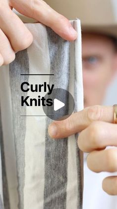 a person holding onto a cloth with the words curly knits written on it in front of them