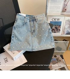 Dare to be bold and stylish with our rivet embellished layered denim skort from the 2023 Summer Collection! Lovingly crafted for the modern fashionista. this skort promises to make a lasting impression with its intricate patchwork. mid-waist fit. and zipper & button closure. Why You'll Fall In Love Rivet Embellished: Make a statement with this skort. adorned with intricate rivet details for a touch of chic sophistication. Layered Denim: Its layered denim material ensures comfort and breathability. allowing you to move freely and flaunt your style with ease. Patchwork Perfection: Each layer of denim is expertly adorned with an intricate patchwork design. adding a delightful touch of visual allure. Mid-waist Fit: Its mid-waist fit accentuates your figure. creating the perfect balance between Trendy Summer Denim Skirt, Trendy Spring Mini Skirt, Spring Party Denim Skirt, Trendy Mini Denim Skirt For Spring, Trendy Mid-rise Denim Skirt For Spring, Trendy Non-stretch Pleated Skirt, Non-stretch Trendy Pleated Skirt, Trendy Mid-rise Summer Skirt, Summer Party Denim Skirt