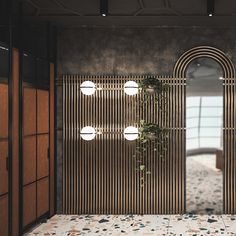 an open door leading to a bathroom with tiled flooring and wood paneled walls