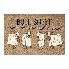 a door mat with three sheep and bats on it that says bull sheet, halloween