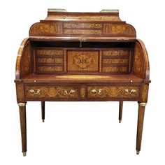 an old wooden desk with ornate carvings on it