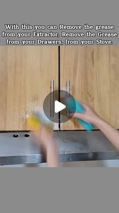 a person using a tool to remove the grease from an oven