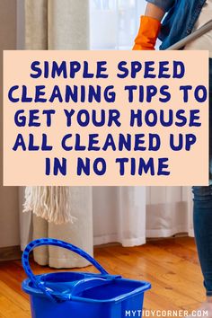 a woman is cleaning the floor with a blue bucket