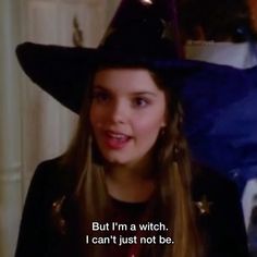 a woman wearing a witches hat with the caption, but i'm a witch i can't just not be