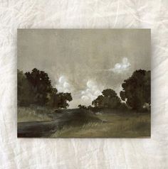 an image of a painting on the wall with clouds in the sky above it and grass below