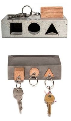 two key chains are attached to a concrete box with keys hanging from the front and back