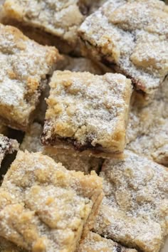 some brownies are stacked on top of each other with powdered sugar toppings