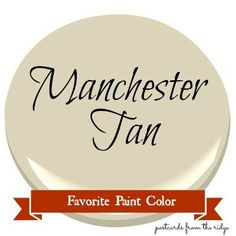 the manchester fan logo is shown on a white button with red ribbon and black lettering