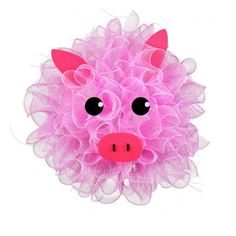 a pink stuffed animal with black eyes and large, fluffy ruffles on it's head