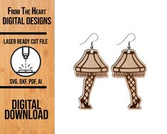 the wooden earrings are designed to look like an eiffel tower with a lamp on it