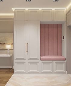 a room with white cabinets and pink cushions on the bench in front of two lamps