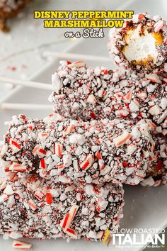 some kind of marshmallow on a stick with candy canes and sprinkles