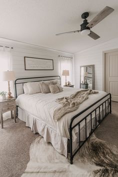 a bedroom with white walls and carpeted flooring