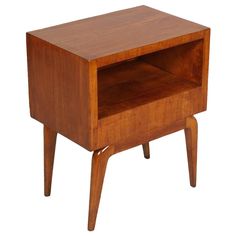 a small wooden table with one drawer open