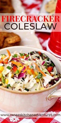 a white bowl filled with coleslaw on top of a red and white checkered table