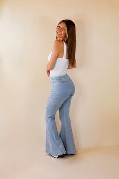 Elevate your look with our All I Needed Denim Bell Bottoms in Light Wash! Stylish light wash and detailed stitching make these flared jeans stand out in a sea of otherwise plain denim. Fall in love with the comfortable fit and timeless bell bottom design of these top-quality jeans. Get them today and stand out from the crowd! Inseam measures 32 inches. Arté is wearing a size small. Size Measurements: Small: Waist: 26 inches around | Rise: 10.5 inches Medium: Waist: 28 inches around | Rise: 10.5 Denim Bell Bottoms, Giddy Up Glamour, Bottom Design, Women Pants, Bell Bottom, Flared Jeans, A Sea, Small Waist, Bell Bottoms