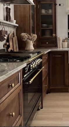 a kitchen with wooden cabinets and an oven