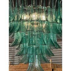 a green chandelier hanging from the ceiling