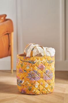 Exclusively at Anthropologie Cotton slub Spot clean Imported | Darby Printed Basket by Anthropologie in Yellow, Cotton Floor Basket, Stackable Wine Racks, Yellow Floor, Anthropologie Home, Unique Cabinets, Iron Candlesticks, Yellow Fits, Wine Holder, Fabric Baskets