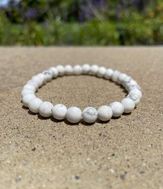 This beautiful white howlite bracelet contains high quality 6 mm Natural Stone. Each bracelet is hand crafted with high quality elastic stretch cord to ensure it's of the best quality. - Each bracelet is hand made when ordered - Natural stone looks and feels great - Suitable to wear every day - All beads are natural and may have differences in size and color SIZE All bracelets are made at 7.25 inches. If you need a different size just let me know when ordering. Measure your wrist at the location where you will be wearing it. Thank you for stopping by and supporting my small business. Howlite Bracelet, White Howlite, Natural Stone, Natural Stones, Every Day, Jewelry Bracelets, Hand Made, Hand Crafted, Beaded Bracelets