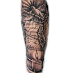 a man's arm with an eagle, candle and quote on the side tattoo