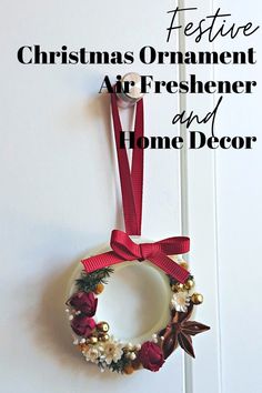 christmas ornament air freshener and home decor hanging on the wall with red ribbon