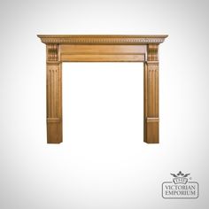 an antique style fireplace surround with carved wood