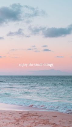 an ocean with the words enjoy the small things written in white on it's side