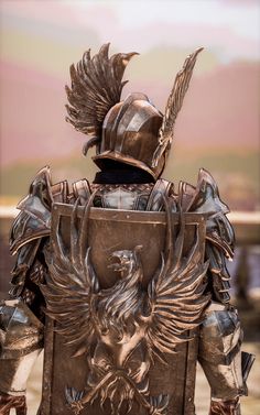 a statue of a man in armor with an eagle on his back