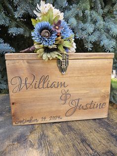 a wooden box that has some flowers in it and the words william and jasmine written on it