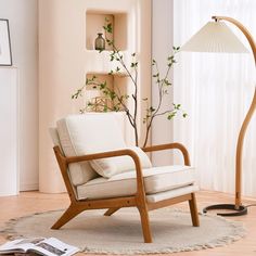 a living room with a chair and lamp in it