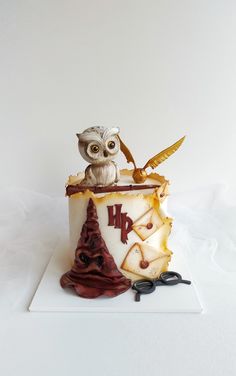 an owl figurine sitting on top of a cup