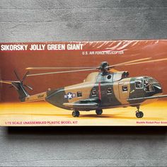 the box is open to show an image of a helicopter