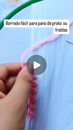 someone is stitching together pink thread on a blue shirt with green cord and the words, barrao facii para pao de prano de prato ou frato ou fridadas