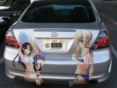 a car that has some anime pictures on it