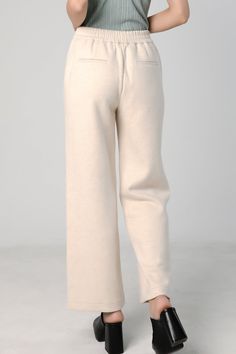 Stay Comfortable and Stylish with our Straight Leg Sweatpants Perfect for living in, these cozy sweatpants are also stylish. They're warm enough to be worn out in cool weather. The raw cut side seam elongates your legs. Features a wide waist band with drawstring and side pockets. Style #: WWSI901 Winter Full-length Pants With Ribbed Waistband, Relaxed Fit Solid Wide Leg Pants For Winter, Winter Wide Leg Pants Solid Relaxed Fit, Winter Wide Leg Relaxed Fit Pants, Cream Wide-leg Sweatpants With Elastic Waistband, Cream Wide Leg Sweatpants With Elastic Waistband, Casual Wide Leg Pants With Ribbed Cuffs, Solid Color Wide Leg Bottoms With Ribbed Cuffs, Comfortable Winter Loungewear Bottoms