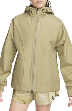 Power through wind and rain in this hooded running jacket in a lightweight, free-moving design bolstered with Gore-Tex weatherproofing. Conveniently placed storage lets you safely stash essentials, and the entire design packs into the pocket so you can gear up or down depending on the weather. Two-way front-zip closure Drawcord-toggle hood Adjustable hook-and-loop cuffs Front zip pockets; rear zip pocket Packs into pocket Back vent Gore-Tex Infinium insulation is windproof, water-resistant and b Gortex Jacket, Nike Web, Sports Wear Women, Packable Jacket, Wind And Rain, Women Sports, Outdoor Jacket, Sports Wear, Running Jacket