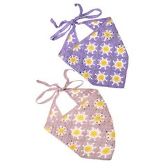 two purple and yellow bibs with bows on the top, one has daisies