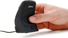 a hand is pressing the button on an electronic device that appears to be plugged in