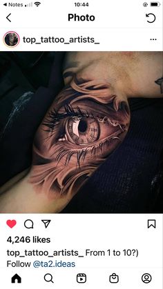 an eye tattoo on someone's arm