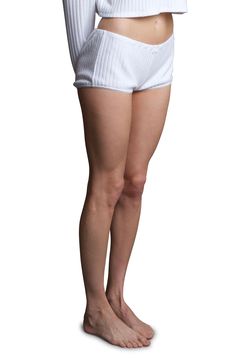 With a drapey fit and flirty picot trim, these ribbed lounge pants will become your day-to-night essential. 1" inseam; 22" leg opening Pull-on style 48% polyester, 40% rayon, 4% spandex Machine wash, dry flat Made in the USA White Loungewear Bottoms With Short Inseam, White Bottoms With Short Inseam For Loungewear, White High-cut Leg Bottoms For Daywear, White High-cut Leg Bottoms For Daytime, High Waist Ribbed Loungewear Bottoms, High Waist Ribbed Bottoms For Loungewear, Ribbed High Waist Bottoms For Loungewear, White Fitted Pajama Shorts, Stretch Cotton Ribbed Shorts