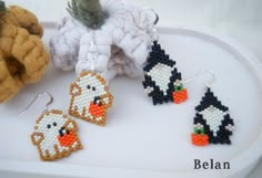 the beaded penguin earrings are on display