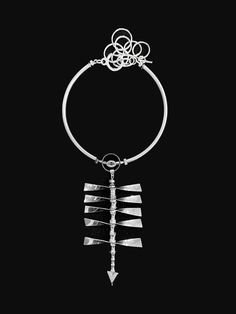 Immerse yourself in the perfect fusion of avant-garde flair and craftsmanship with our Spine Necklace. Suspended from a metal circular ring is a pendant resembling a spinal column, adding a bold and edgy touch to your ensemble. The pendant can be worn at the front, accentuating the chest, or at the back for a unique and daring look. At the end of the pendant, there is a downward-facing arrow, adding an element of intrigue and symbolism to the design. Crafted from premium materials, this necklace Spine Necklace, Spinal Column, Ring Pendant, Accessories Branding, Sale Design, Statement Pieces, The End, Sense, Ring