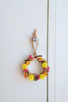 a wreath hanging on the side of a door