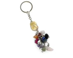 a bunch of different colored stones on a keychain