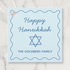 a blue hanukkah card with the words happy hanukkah on it